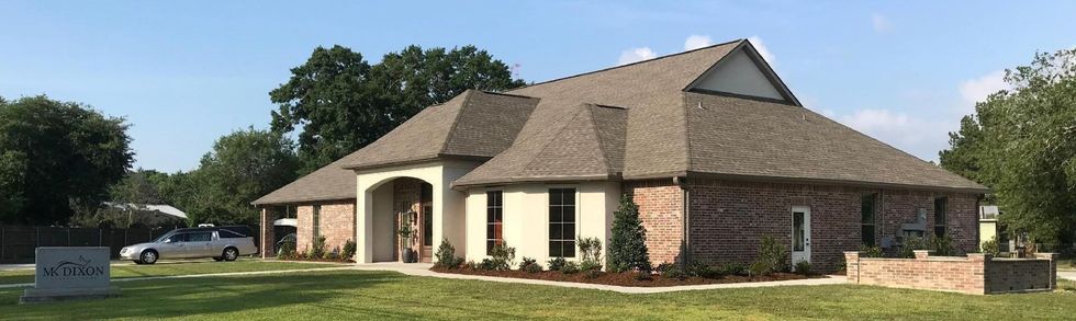 A large office building with a lot of windows on a sunny day.