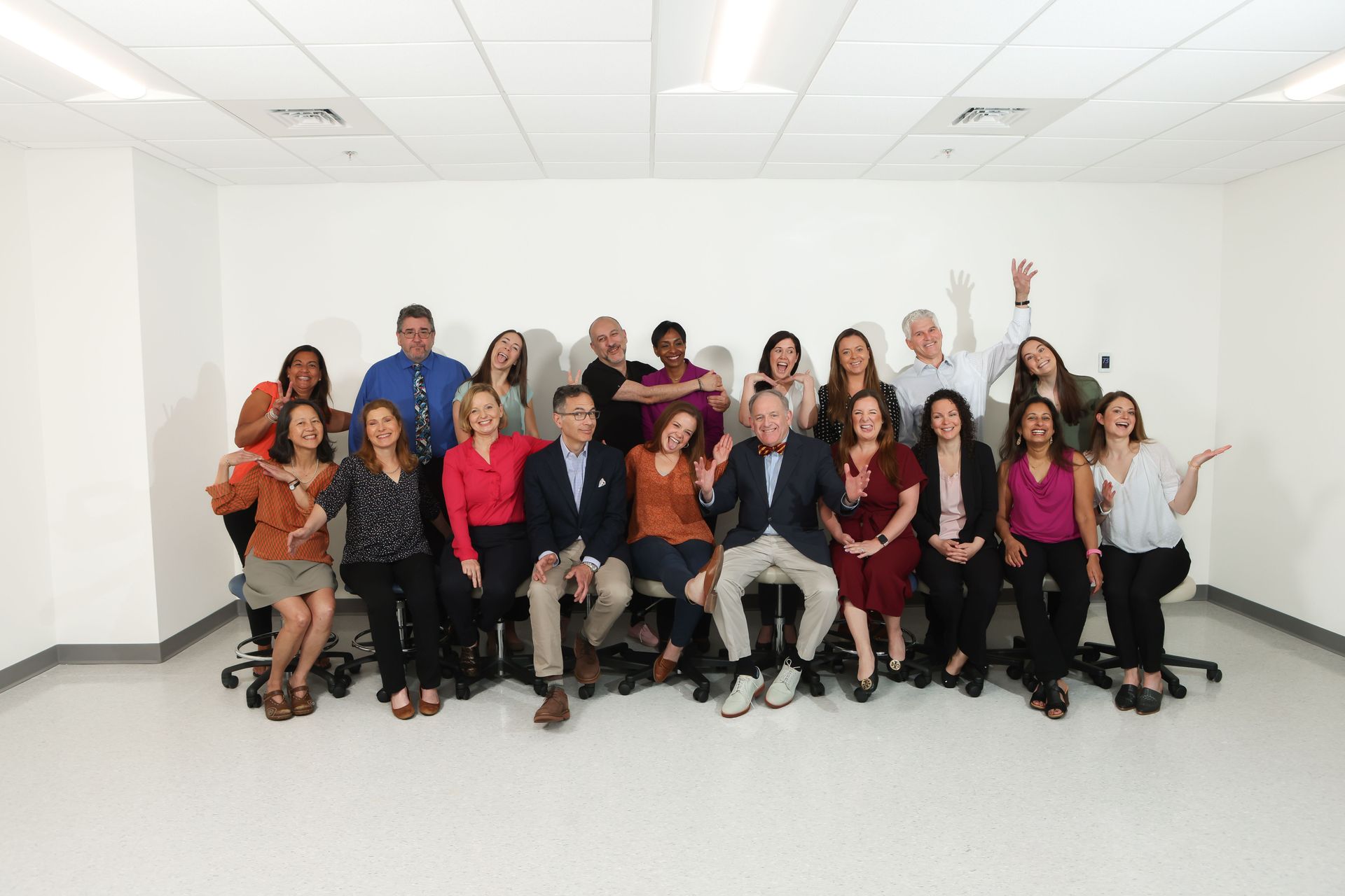 Group of people in a white room.