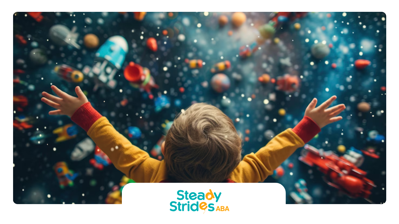 Child with arms raised, looking at colorful space objects.