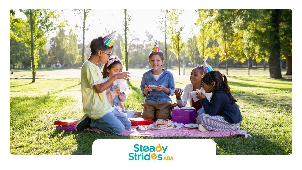 A group of autistic kids enjoying a picnic birthday party outdoors, wearing festive hats in Texas.