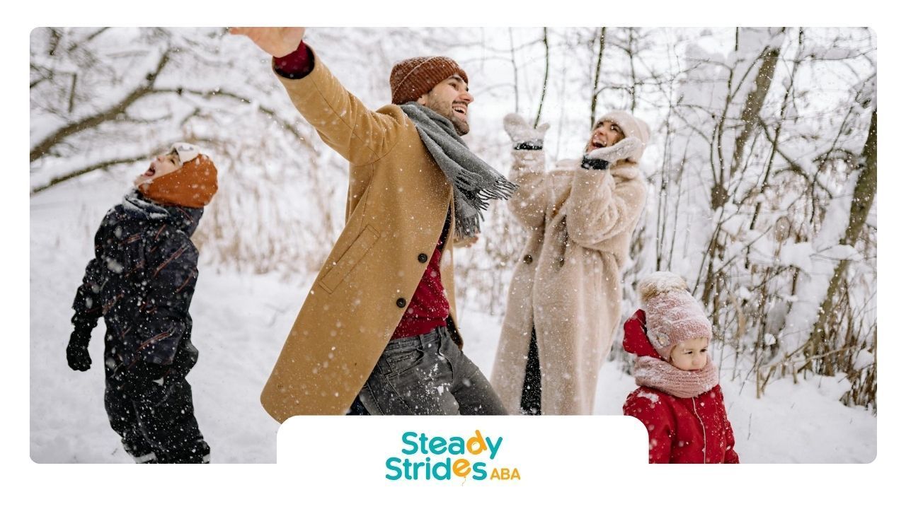 Family with autistic child playing in the snow, laughing and enjoying wintertime together in Texas.