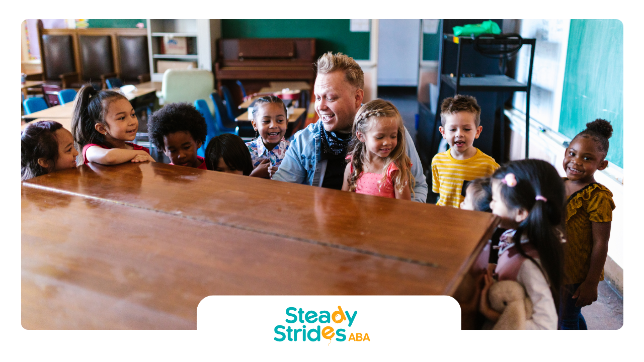 A group of children are sitting around a piano in a classroom.