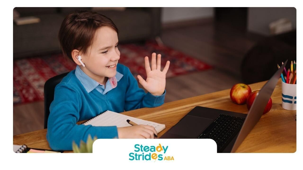 Autistic boy with tics waves during virtual learning at home in Texas with laptop and notes.