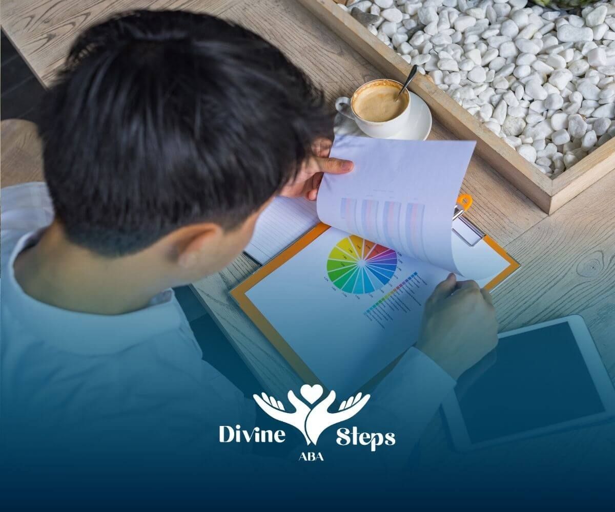 Therapist reviews autism report with colorful pie chart analytics at desk with tablet, coffee.