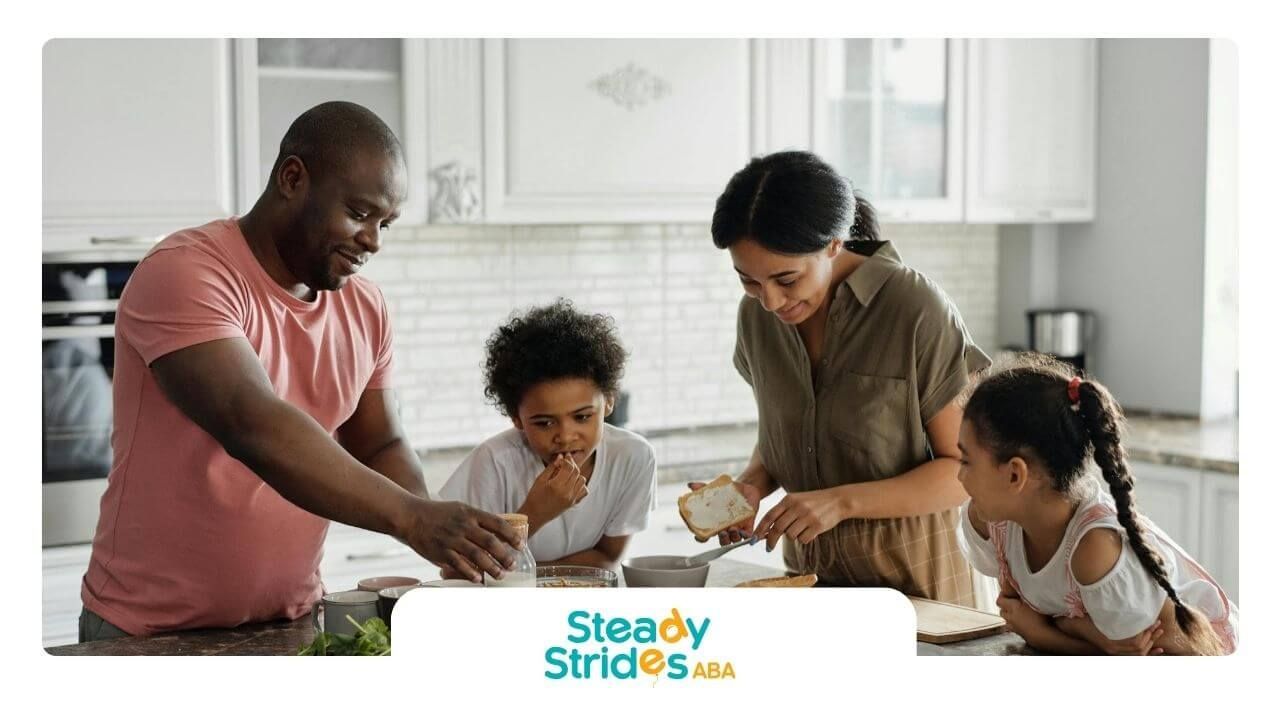 Two ABA therapist prepares food together in bright kitchen with sandwiches and fresh ingredients.