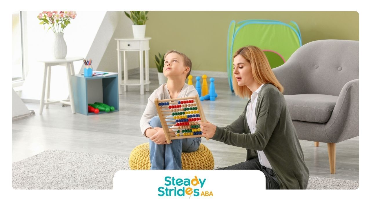 A woman is teaching a child how to use an abacus.