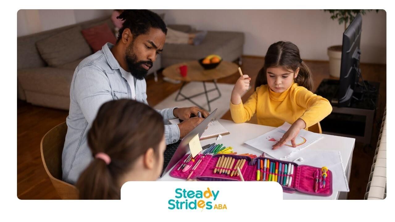 A therapist is guiding autistic children in an arts and crafts activity while helping with drawing.