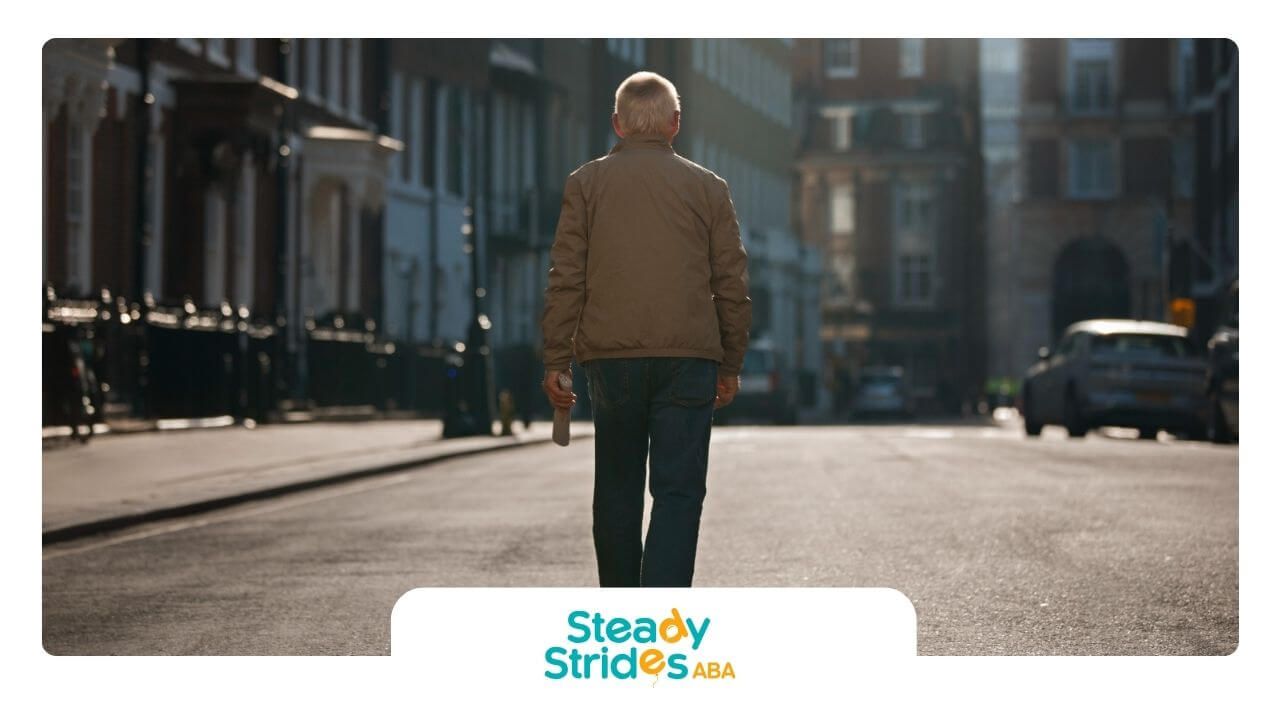 A man in a brown jacket is walking down a city street.