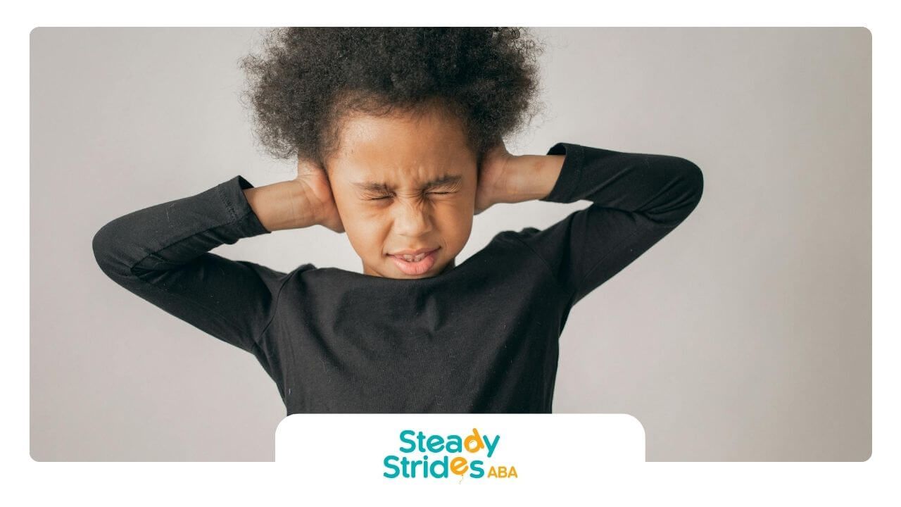 A group of ABA therapist discussing ideas around a table during a team meeting or collaboration.