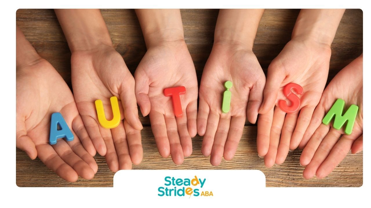 Hands holding colorful letters spelling