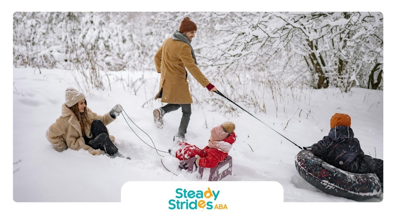 A family pulling autistic children on sleds through deep snow at a winter landscape in Texas.