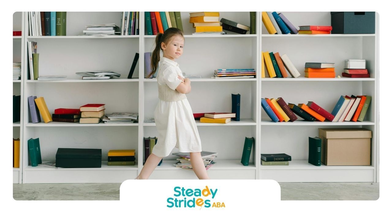 Young autistic girl in white dress is walking in front of a large bookshelf during ABA therapy in TX