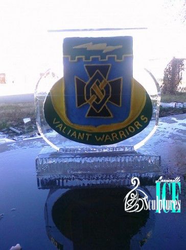 Blue and gold Valhalla Warriors emblem on a car window in bright sunlight