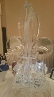 Clear decorative glass centerpiece on a table with tall curved glass accents