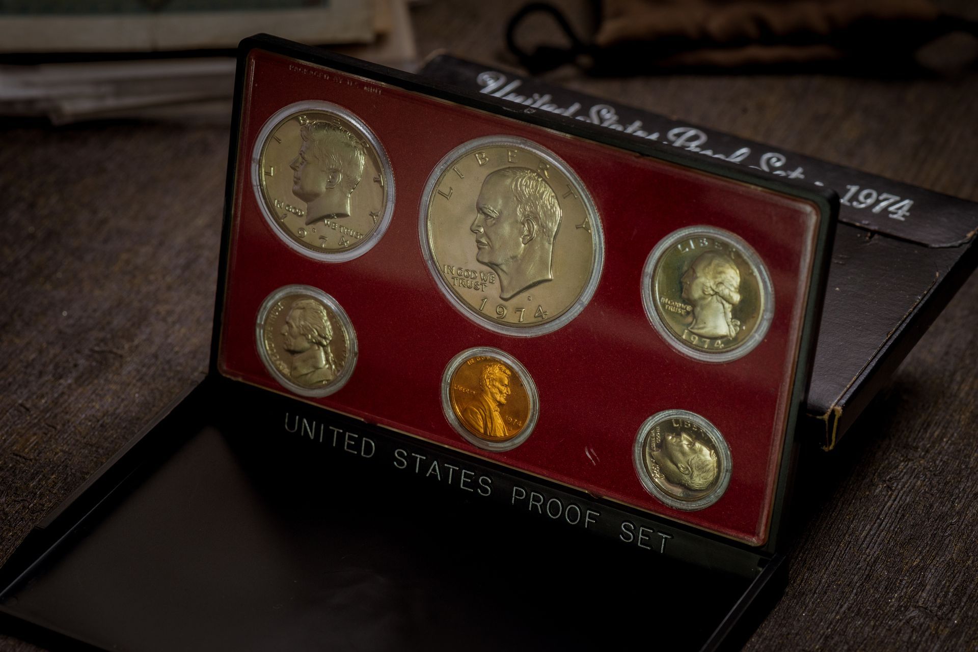 United States Proof Set with six coins displayed in a red case labeled at the bottom.