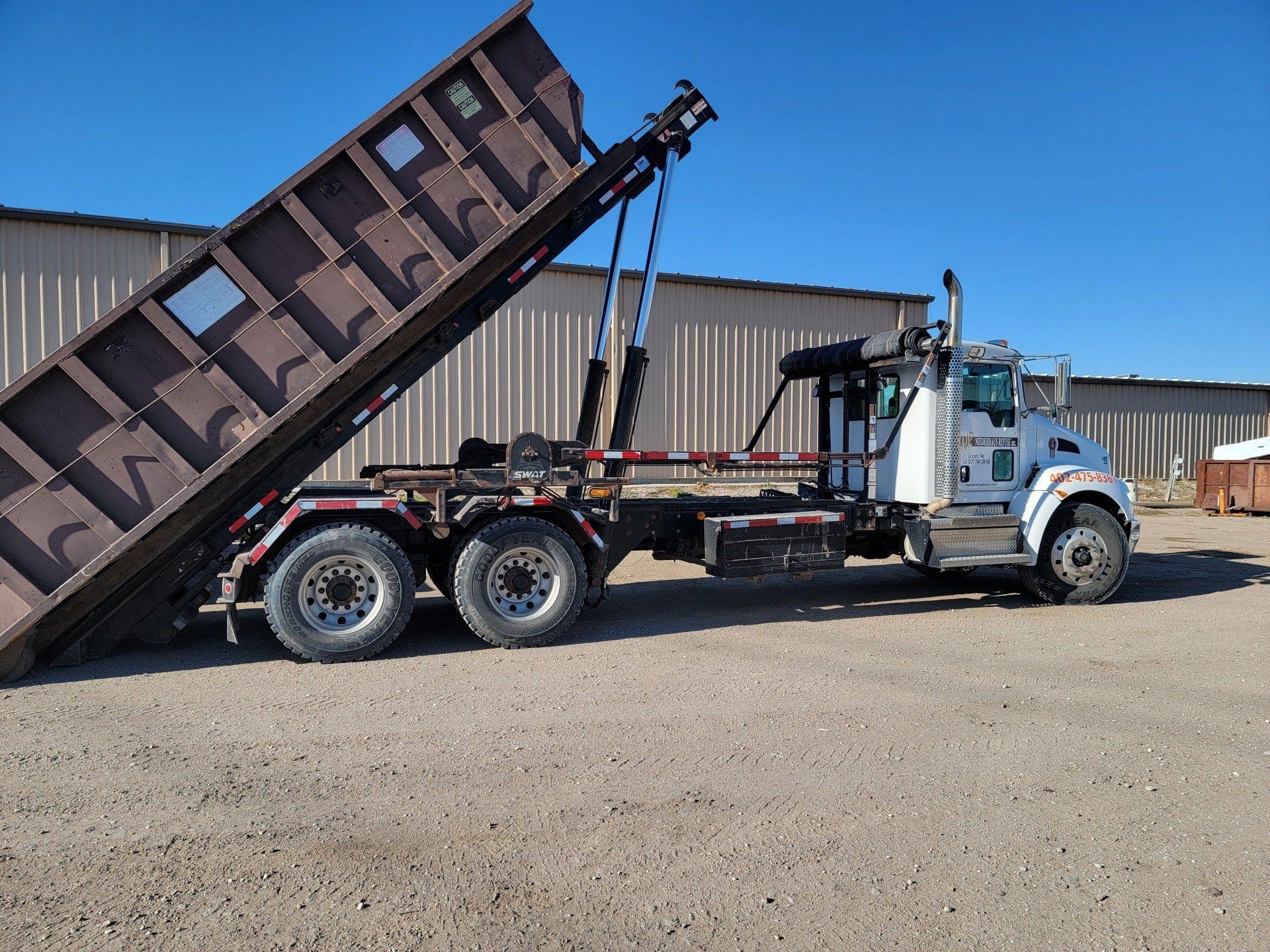 A residential trash hauling truck in Lincoln, NE 