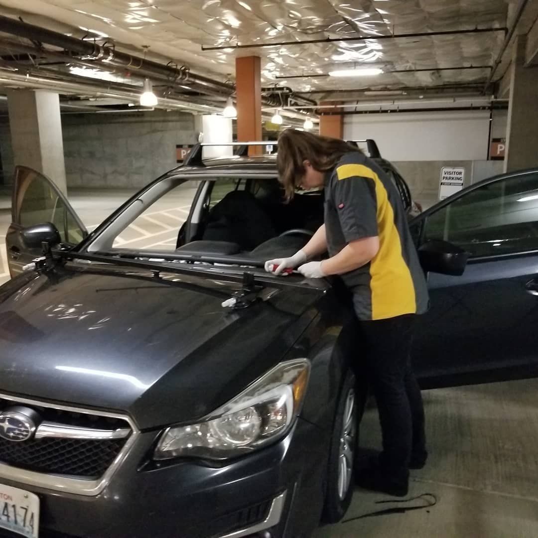 A Woman Standing Next to a Car Windshield - Renton, WA - Good Dog Auto Glass