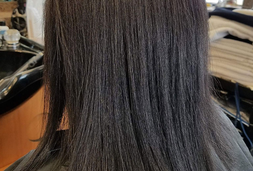 A close up of a person 's hair in a salon.