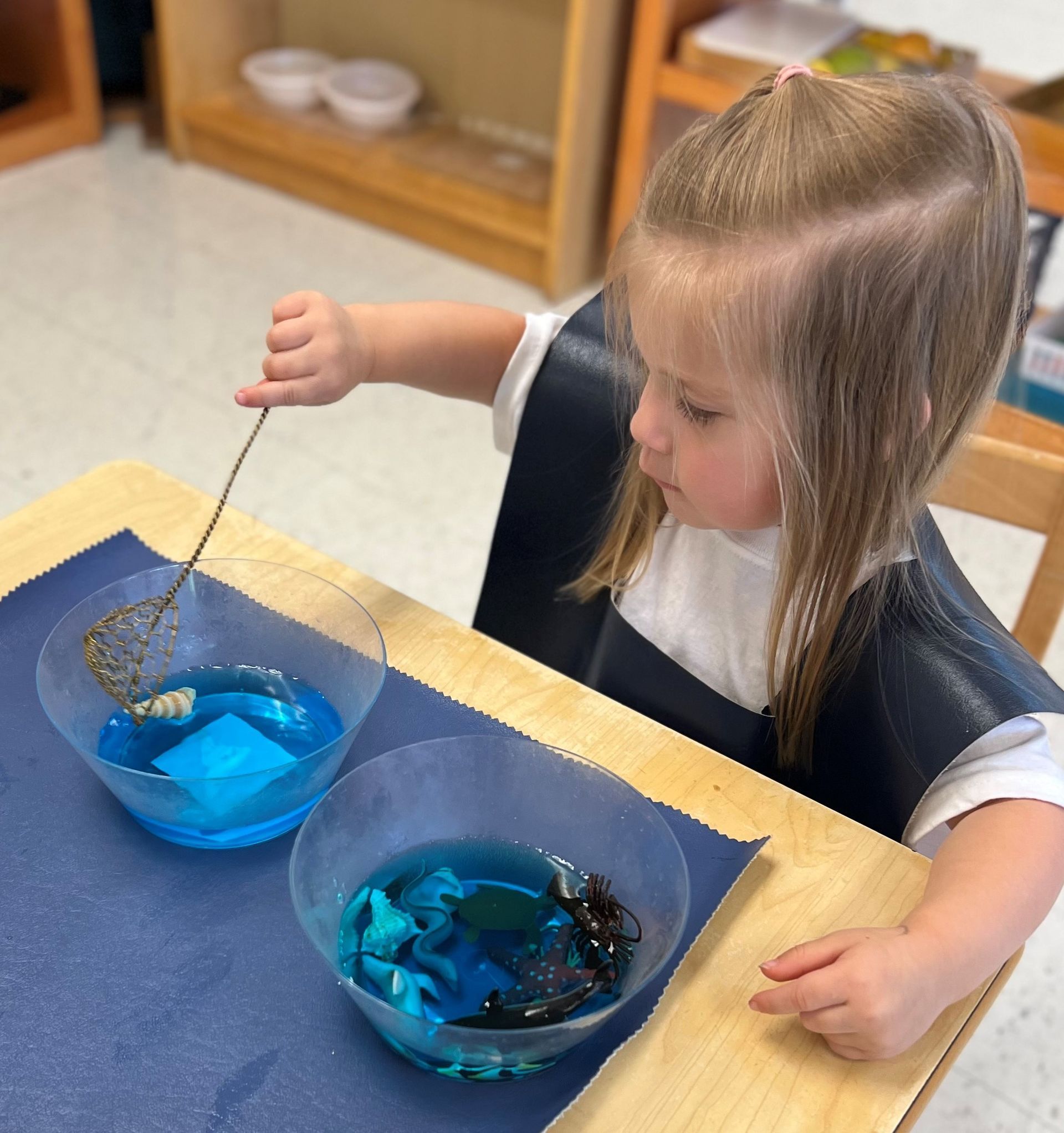 Montessori child is working with materials