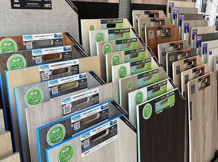 A display of different types of wooden flooring in a store.