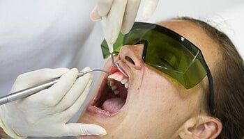 Dentist Using a Modern Diode Dental Laser