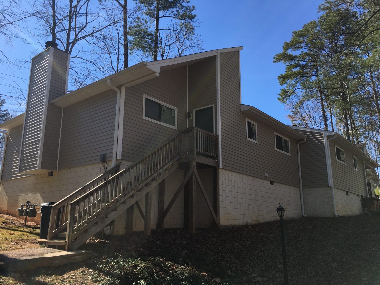 Exterior View of Home with Staircase Leading to Front Door