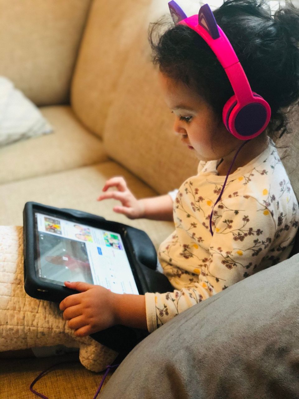 child watching educational video on tablet