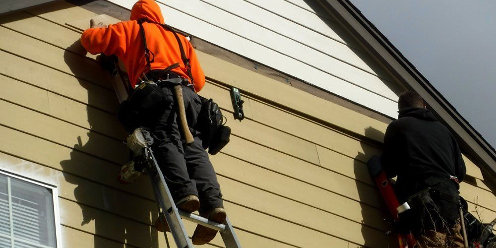 A house is being remodeled with a wooden staircase.