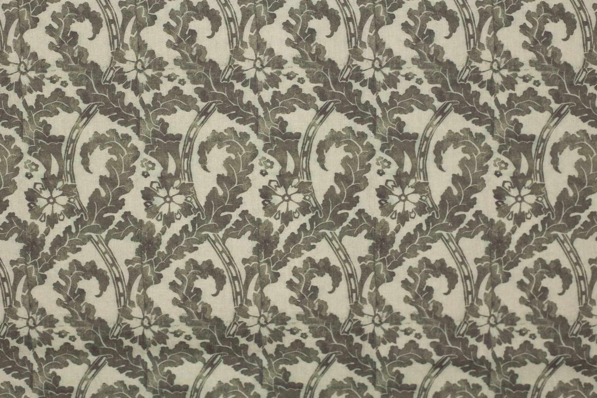 A close up of a couch with a floral pattern on it.