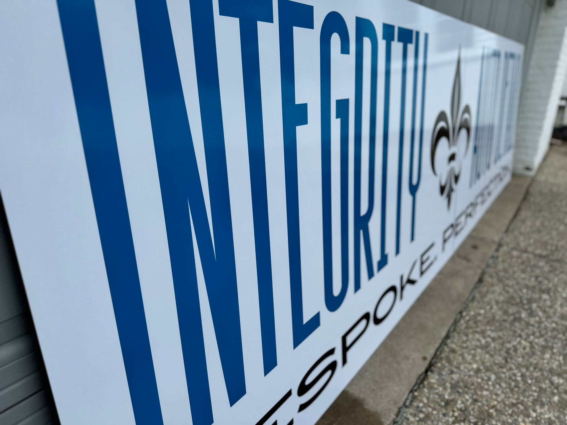A blue and white sign that says integrity on it
