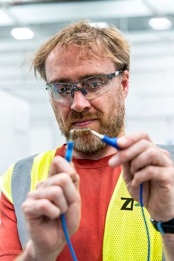 ZPN Employee Engineer Electrician creating spark between two probes