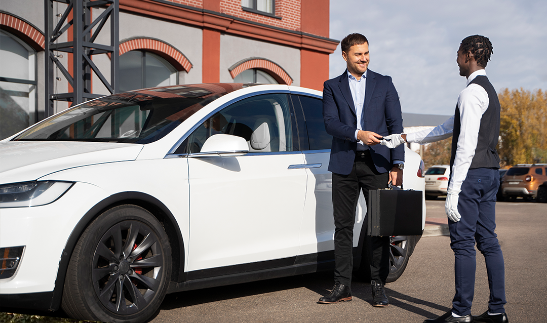 Rep handing over EV car keys to customer