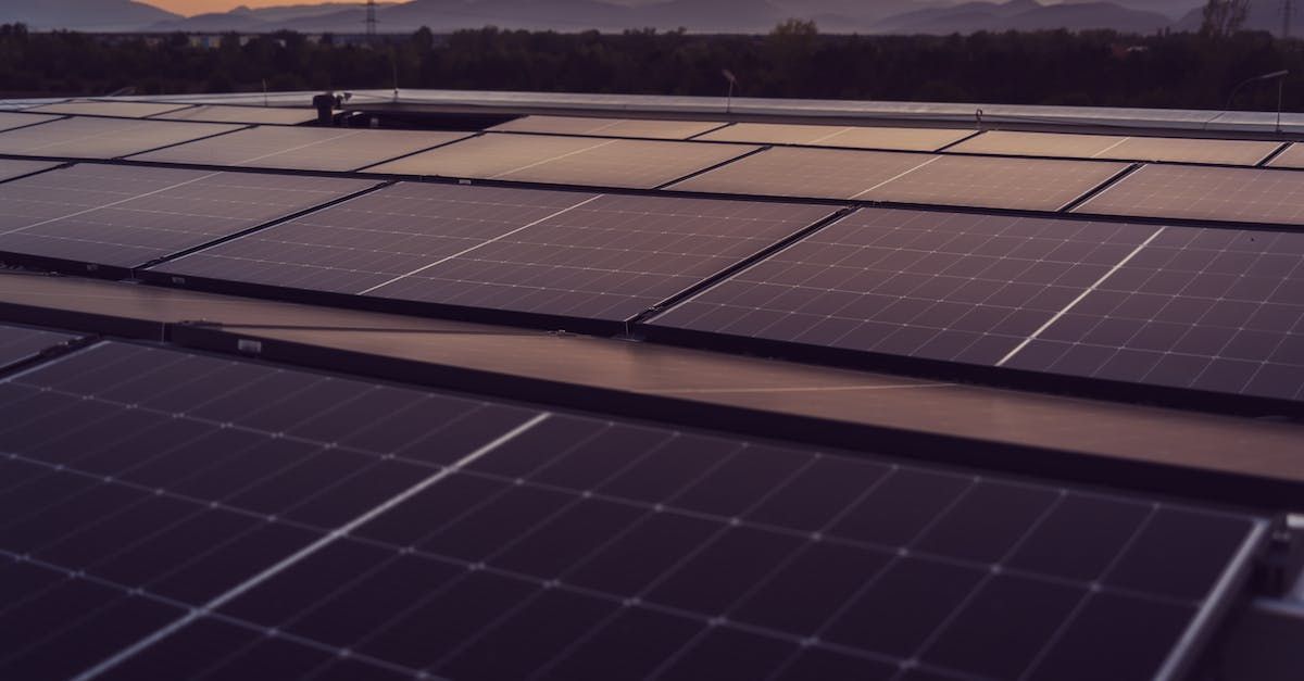 A row of solar panels on the roof of a building