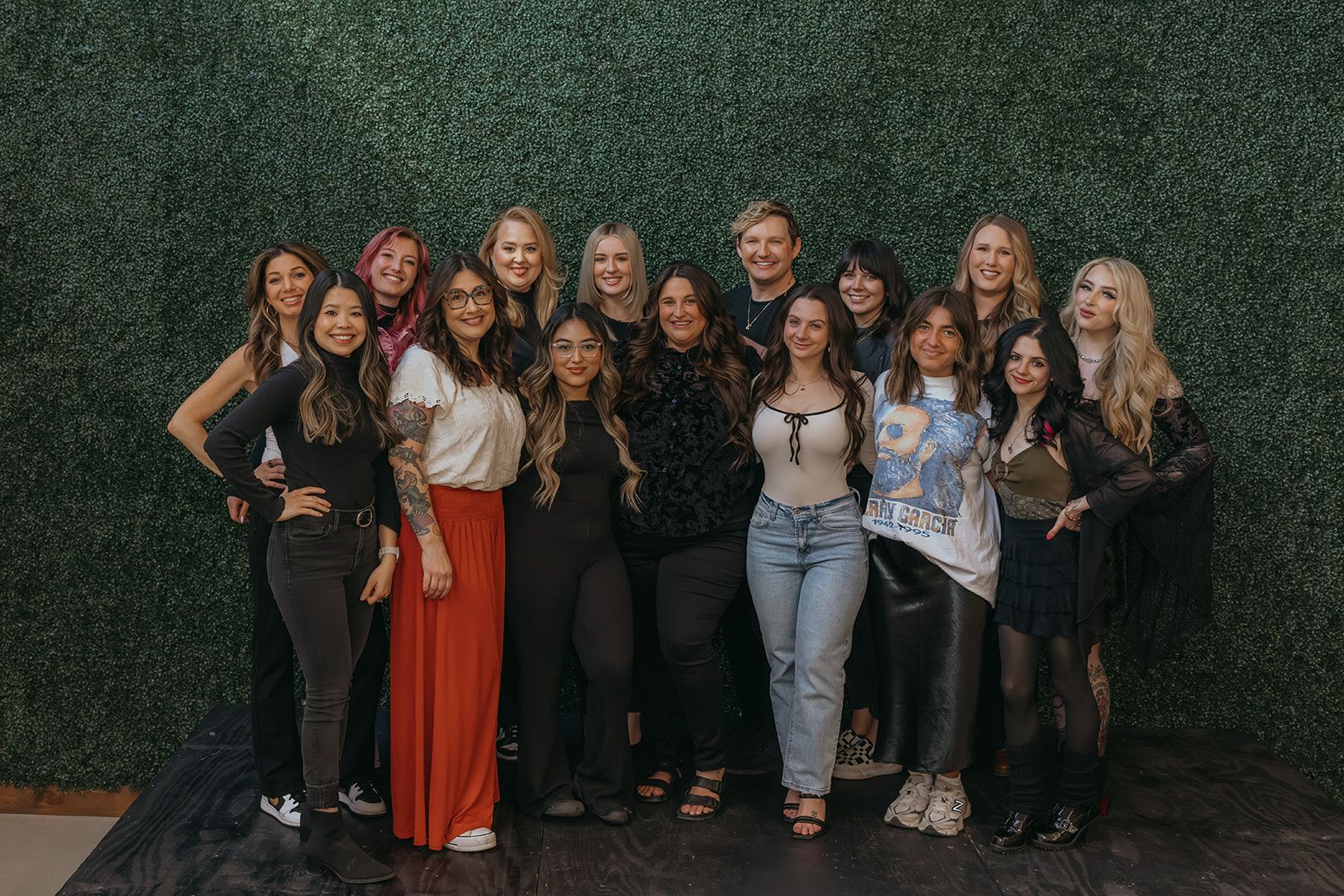 Esmeralda styling a client's hair with rollers
