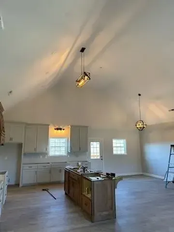 A kitchen with a large island in the middle of the room.