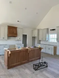 A kitchen with a large island in the middle of the room.