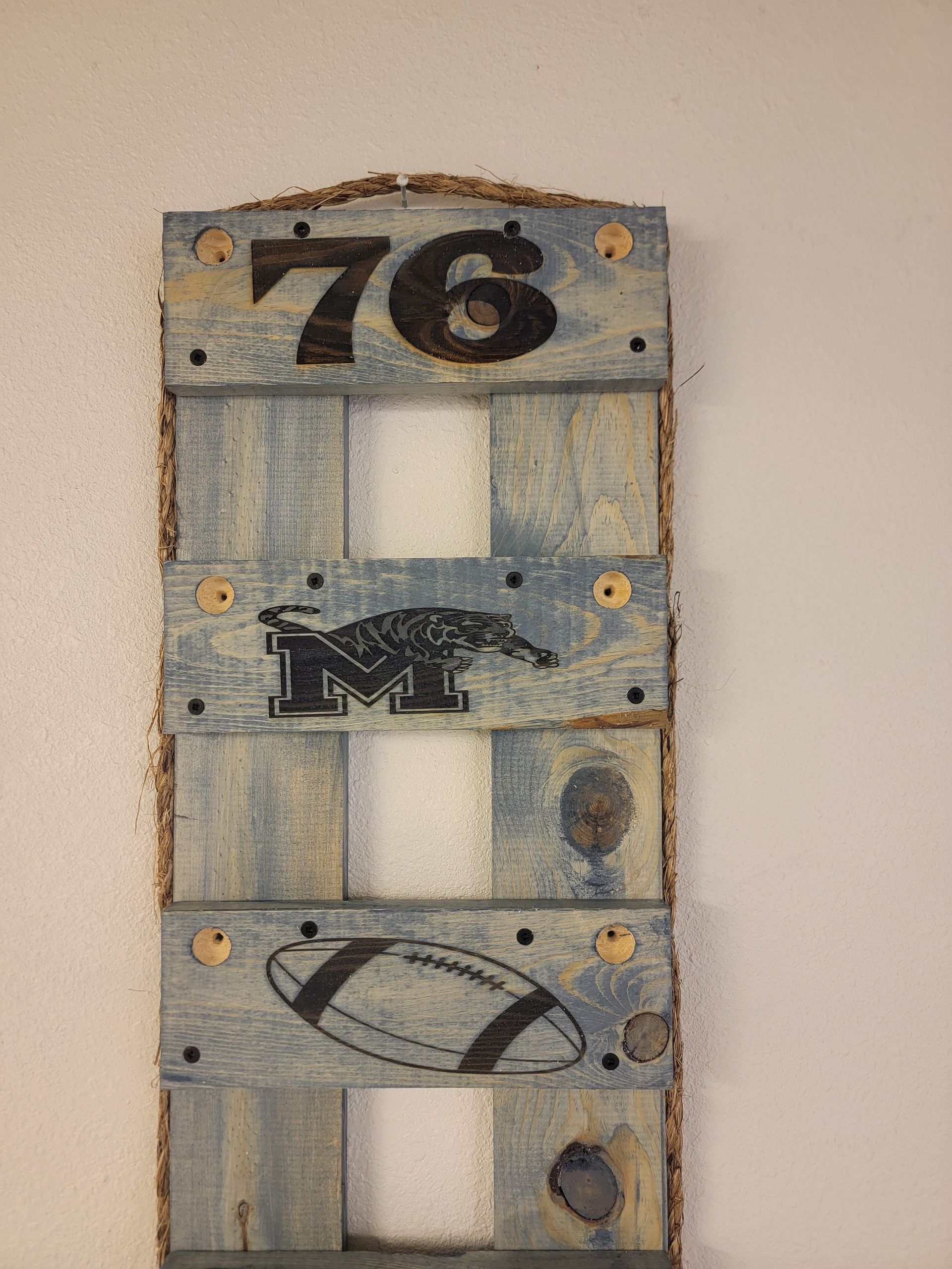 Wooden sign with number 76, 