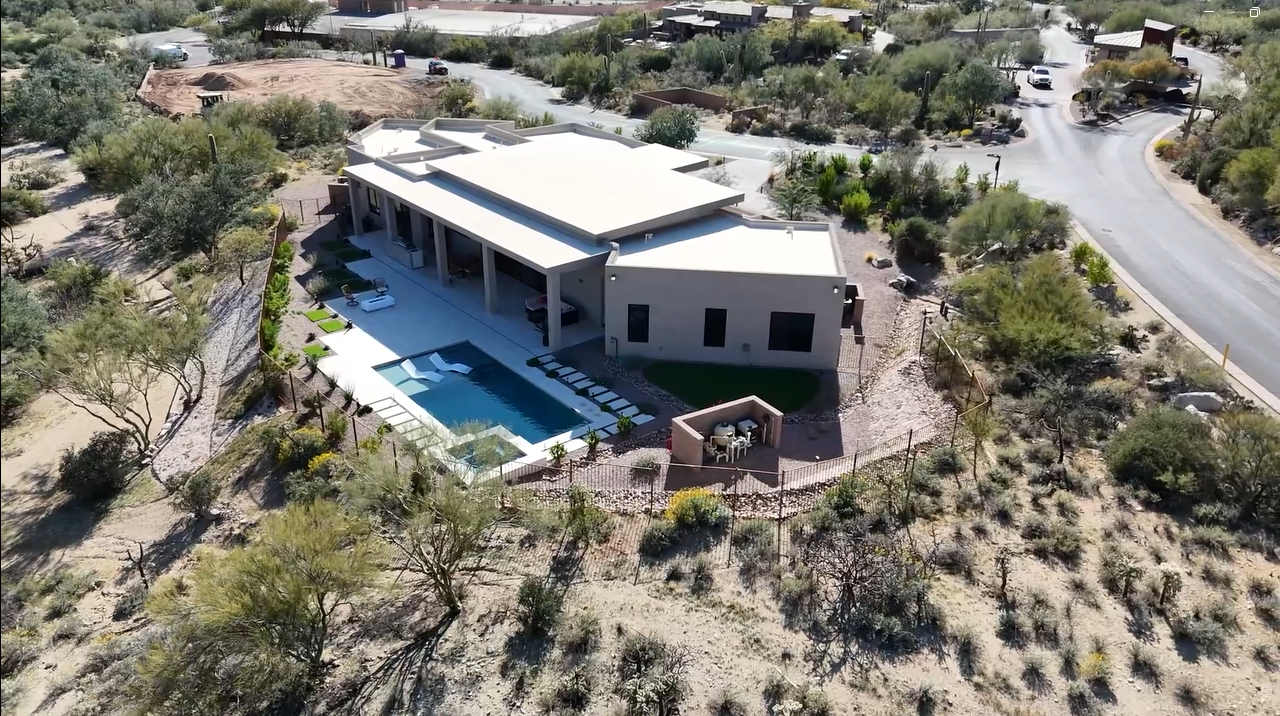 Aerial view of this brand-new luxury home with a private pool in Dove Mountain, Tucson