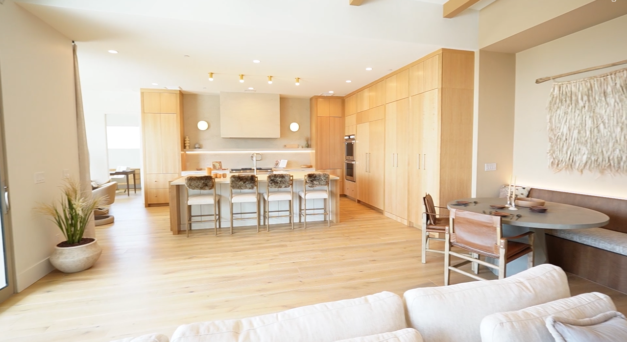 Fairfield Homes' Redington model - high ceiling, modern kitchen, and open living room space in Boulder Canyon 