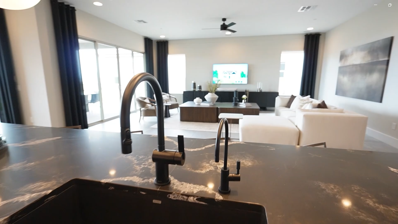 Inside Parklane 2 by Pulte Homes in Marana: living room view from the kitchen