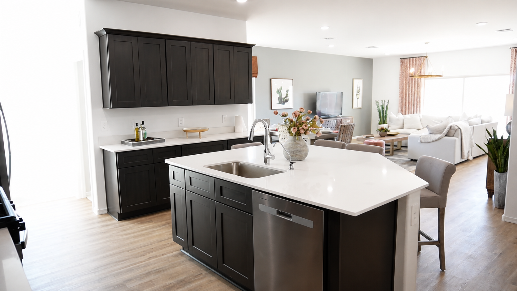 Kingston Floor Plan's kitchen and living room at Saguaro Bloom by D.R. Horton - Marana, Arizona