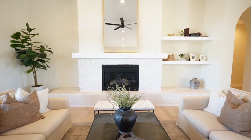 A section of the spacious living area with a gas fireplace in Rancho Soldados by Layland Building Solutions 