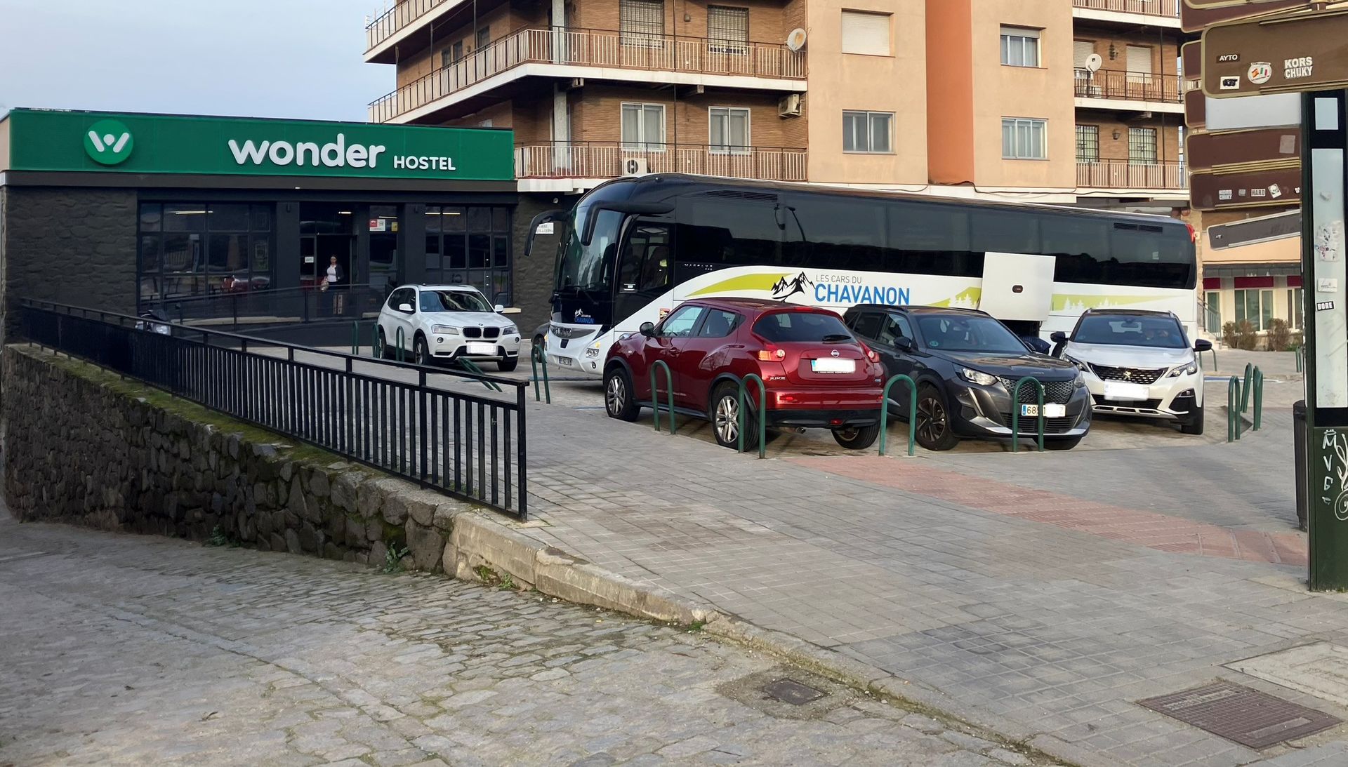 Bus dropping off guests in front of the hostel