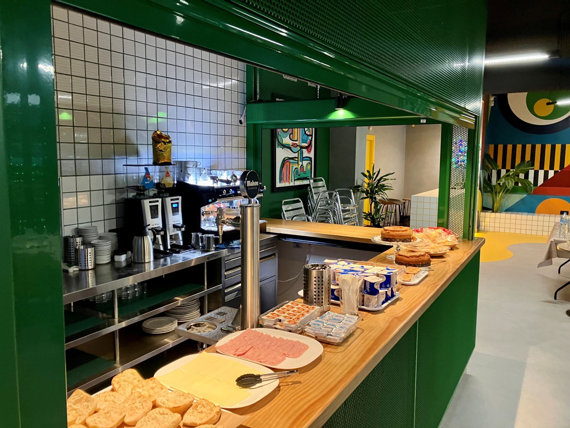 A breakfast buffet with a lot of food on the counter.