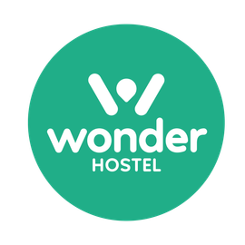 The wonder hostel logo is in a green circle.