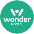 The wonder hostel logo is in a green circle.