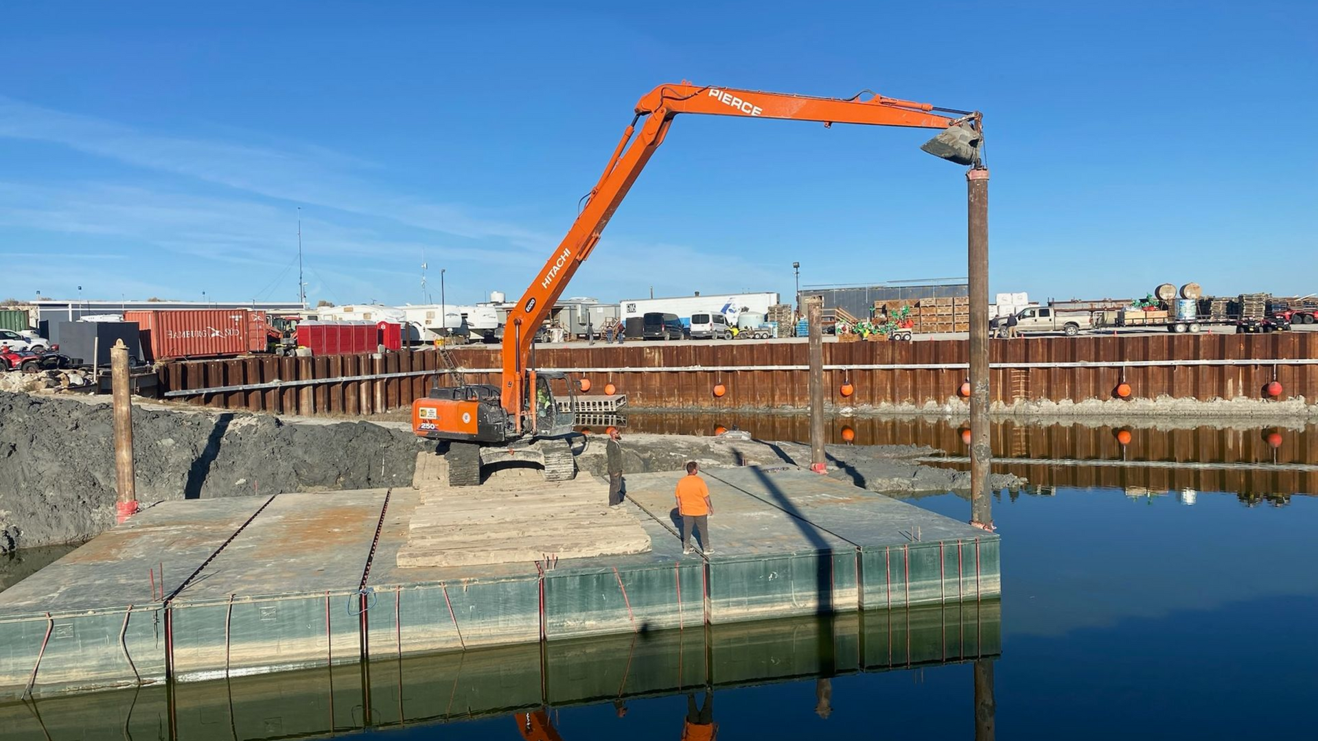 Mining contractors loading aggregate near river staging area in Idaho.