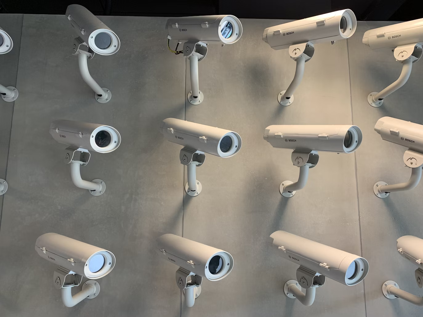 A bunch of security cameras on a wall