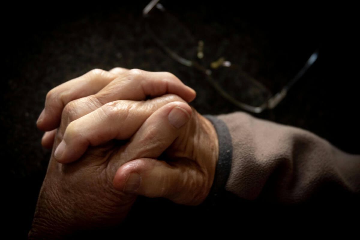 Holding hands as a sign of compassionate support