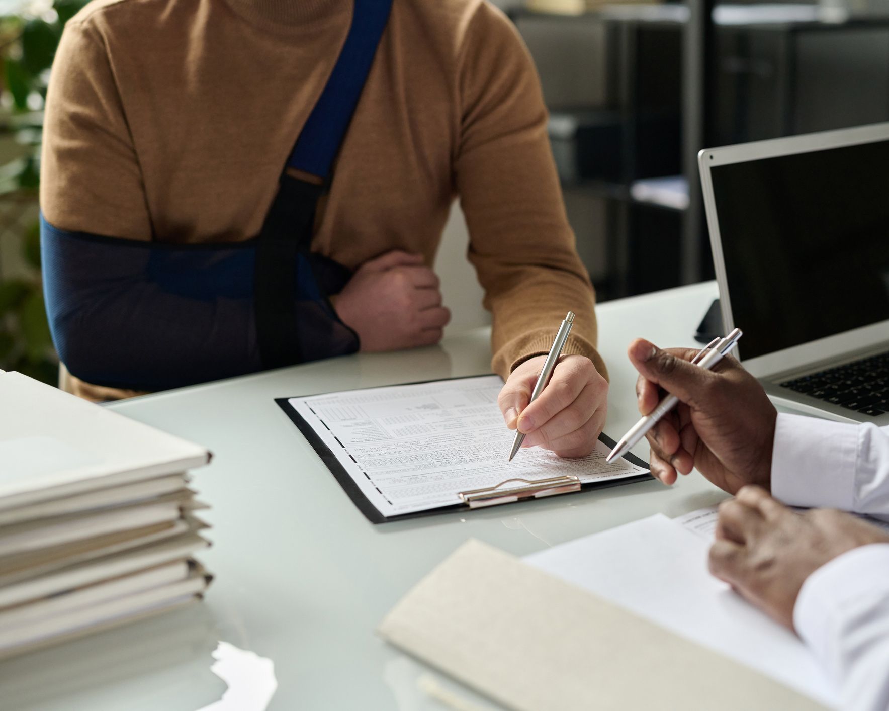 Man Filling in Medical Insurance Form | Fall River, MA | DGK Law